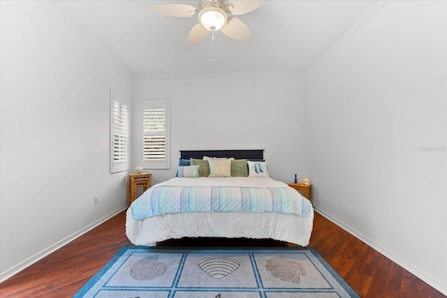 bedroom featuring hardwood / wood-style floors, ceiling fan, and ornamental molding