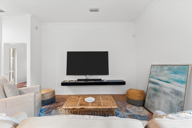 living room with hardwood / wood-style floors and crown molding