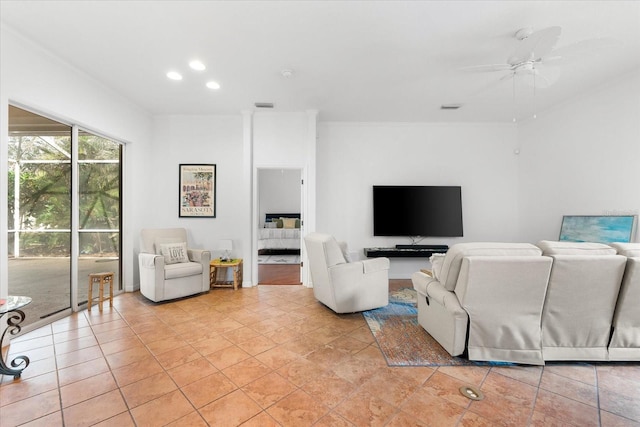 tiled living room featuring ceiling fan