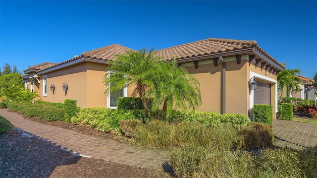 view of side of property with a garage