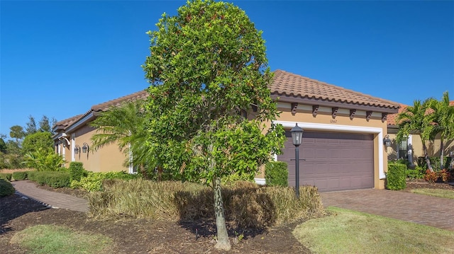 view of front of home with a garage