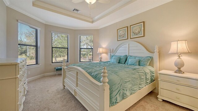 bedroom with light colored carpet, multiple windows, crown molding, and ceiling fan