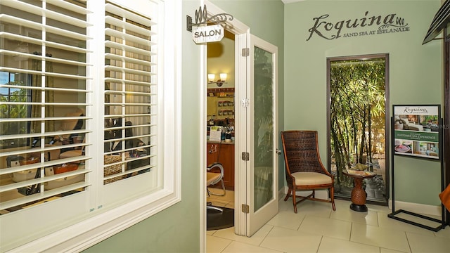 interior space featuring light tile patterned flooring and a healthy amount of sunlight