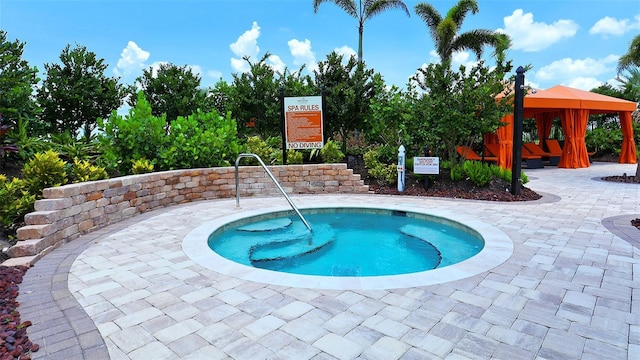 view of pool with a gazebo and a patio area