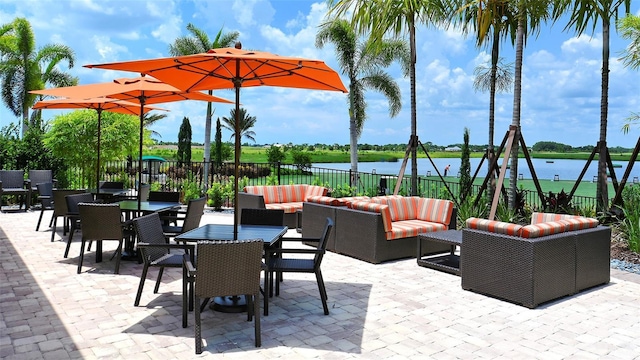 view of patio / terrace featuring outdoor lounge area and a water view