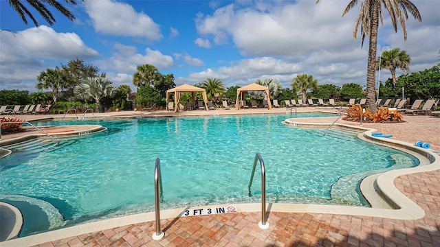 view of swimming pool with a gazebo and a patio