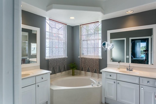 bathroom with vanity and plus walk in shower