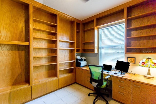 tiled office space featuring built in desk