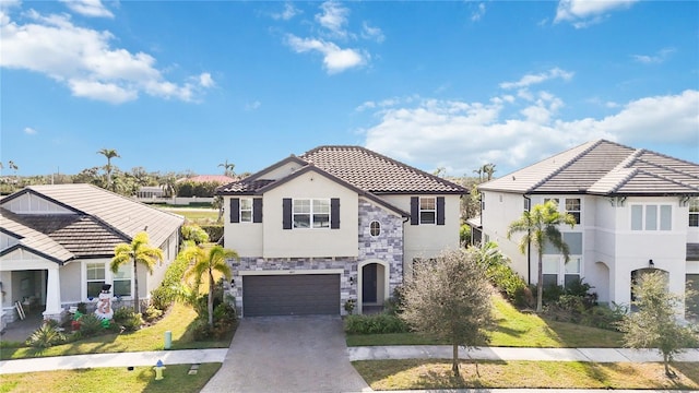 view of front of house featuring a front lawn and a garage