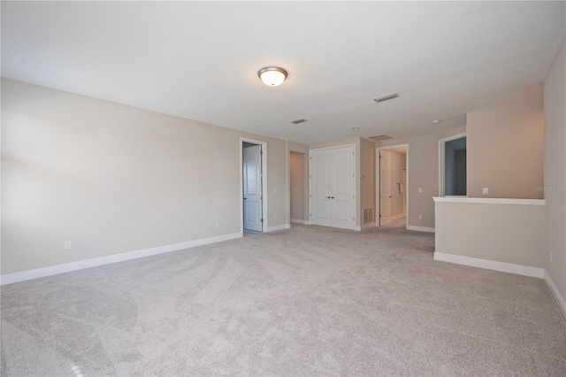 empty room with light colored carpet