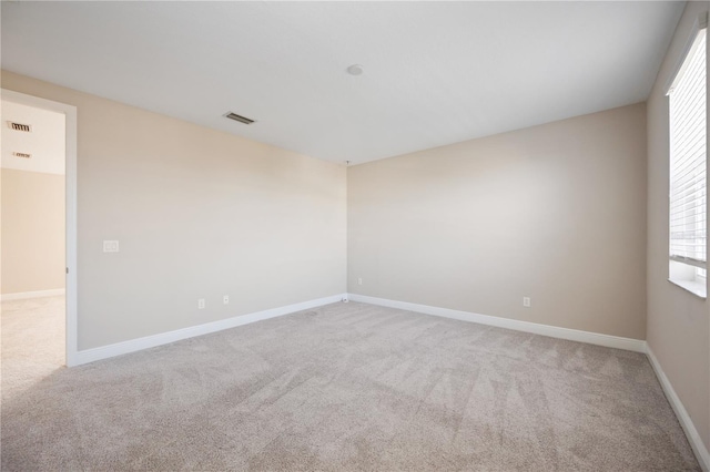 unfurnished room with carpet flooring