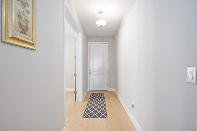 hallway with light wood-type flooring