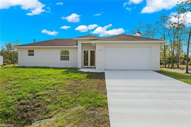 view of front of home featuring a front lawn and a garage