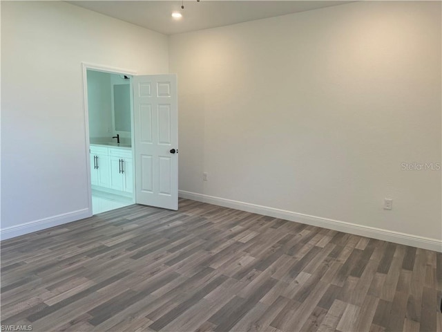 spare room with dark hardwood / wood-style floors