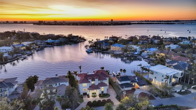 aerial view at dusk with a water view