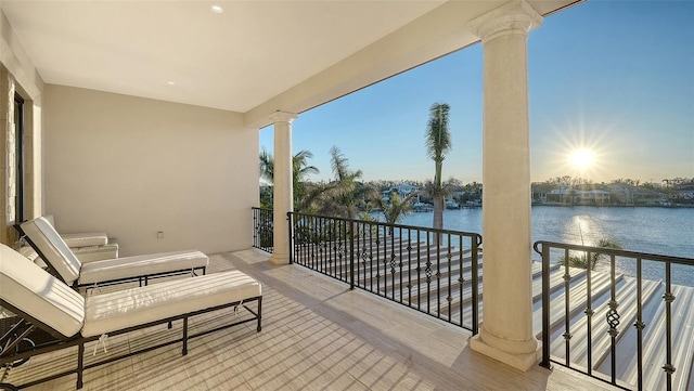 balcony at dusk with a water view