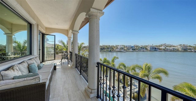 balcony featuring a water view