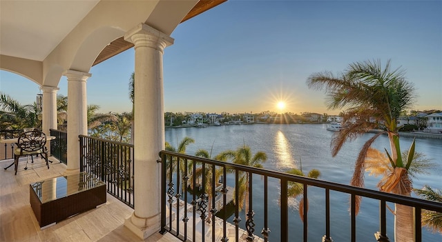 balcony at dusk with a water view