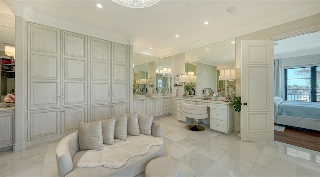 bathroom with vanity and crown molding