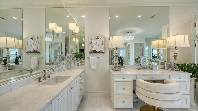 bathroom featuring tile patterned floors, crown molding, and vanity