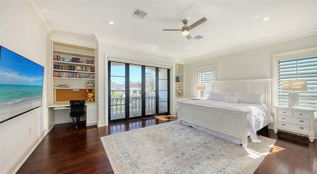 bedroom with access to exterior, ornamental molding, ceiling fan, built in desk, and dark hardwood / wood-style floors