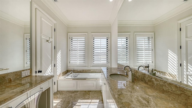 bathroom featuring vanity, crown molding, and a tub