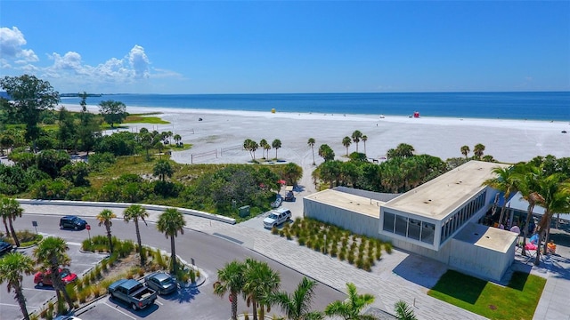 bird's eye view featuring a view of the beach and a water view