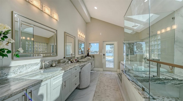 bathroom featuring lofted ceiling, a shower with shower door, and vanity