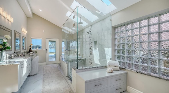 bathroom with lofted ceiling with skylight, an enclosed shower, and vanity