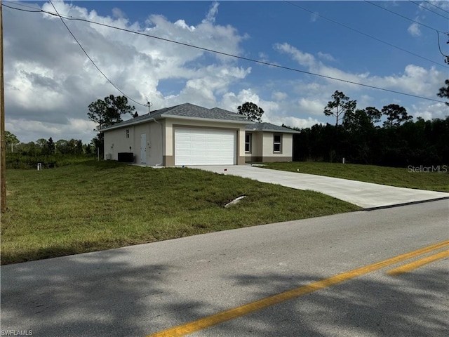 view of front facade featuring a garage, central air condition unit, and a front yard