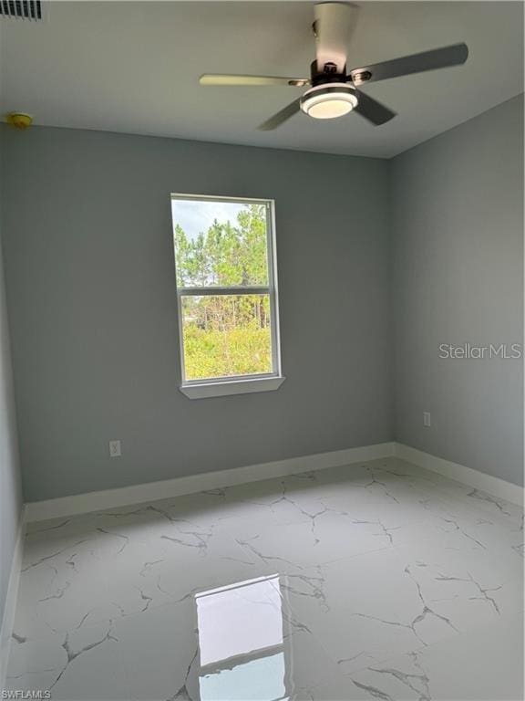 unfurnished room with ceiling fan