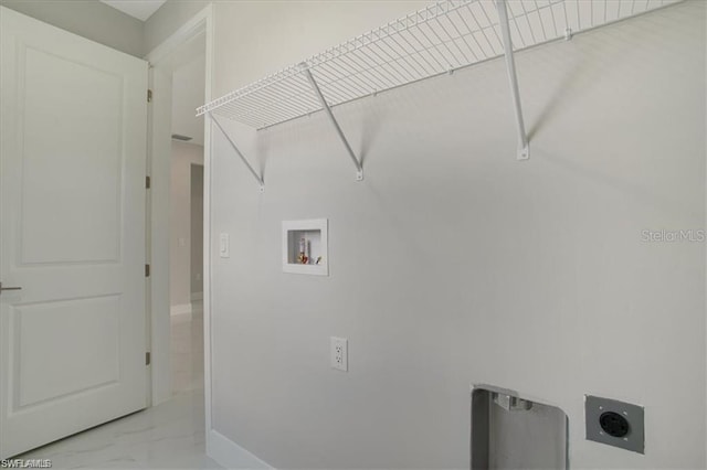 clothes washing area with electric dryer hookup and hookup for a washing machine