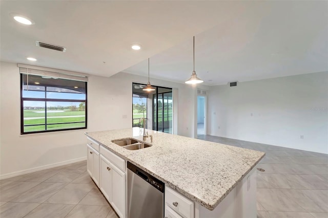 kitchen featuring pendant lighting, a kitchen island with sink, sink, stainless steel dishwasher, and white cabinetry