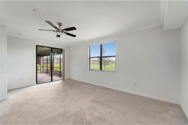 unfurnished room with light carpet, crown molding, and ceiling fan