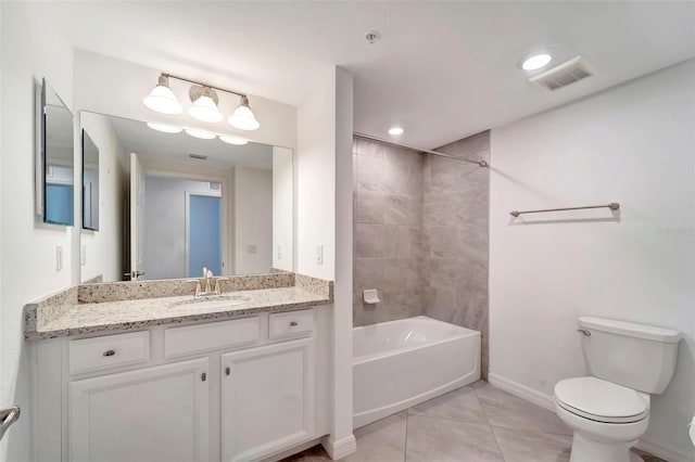 full bathroom with tile patterned flooring, vanity, toilet, and tiled shower / bath