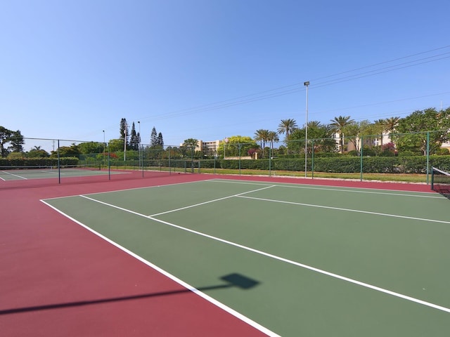 view of sport court featuring basketball hoop