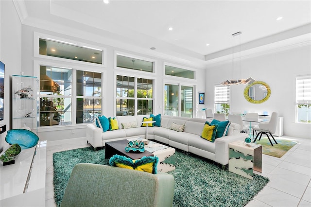 tiled living room with a tray ceiling