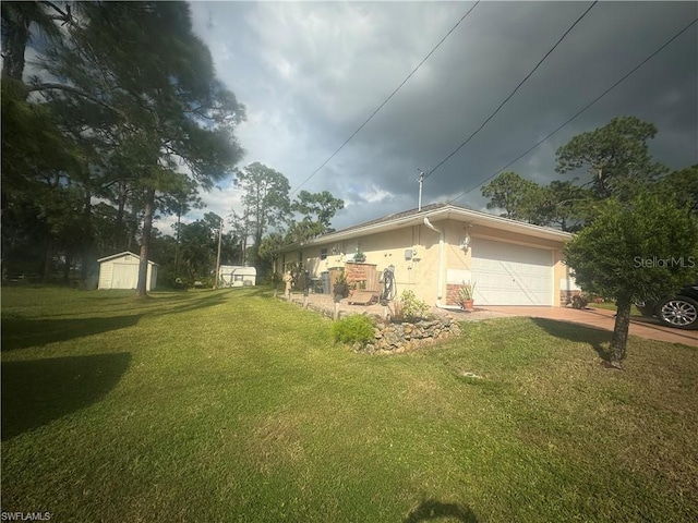 view of home's exterior with a garage, a shed, and a lawn