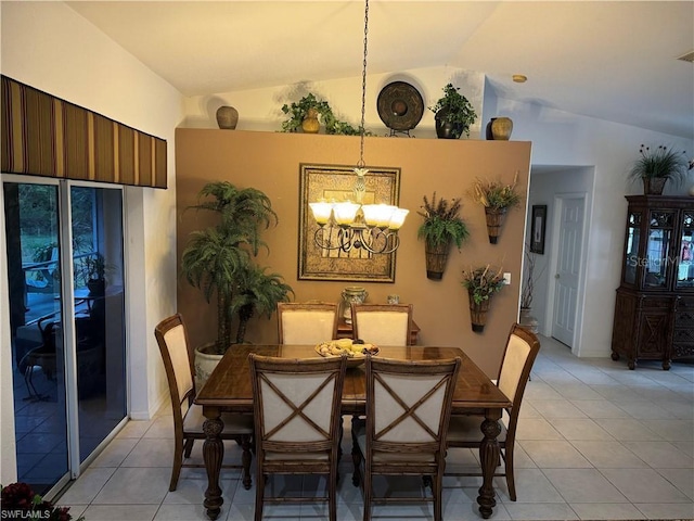 tiled dining area with an inviting chandelier and vaulted ceiling