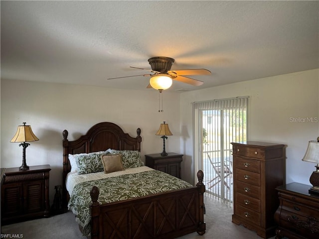 bedroom featuring carpet flooring, access to exterior, ceiling fan, and a textured ceiling