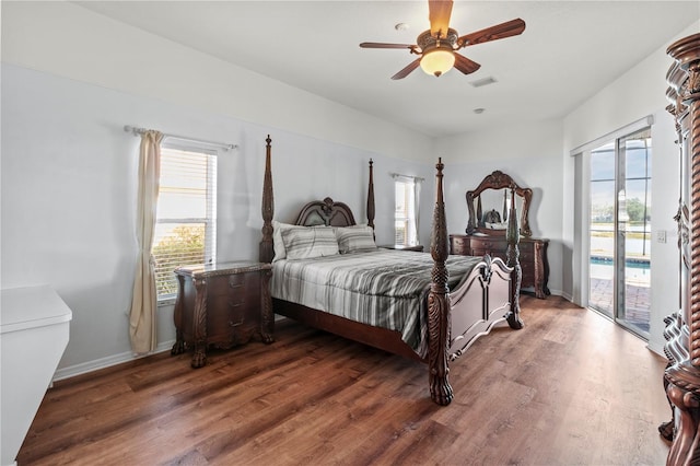 bedroom with hardwood / wood-style flooring, ceiling fan, access to outside, and multiple windows