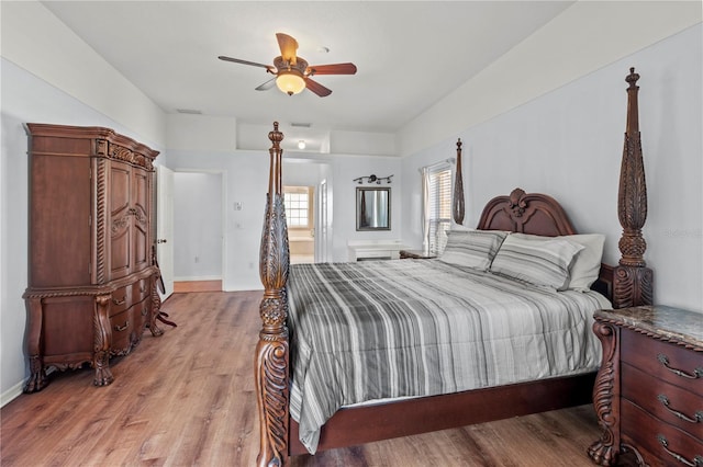 bedroom with ceiling fan and light hardwood / wood-style flooring