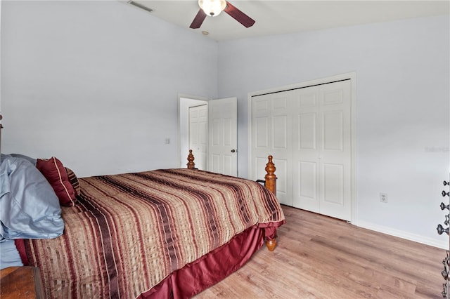 bedroom featuring ceiling fan, a closet, and light hardwood / wood-style floors