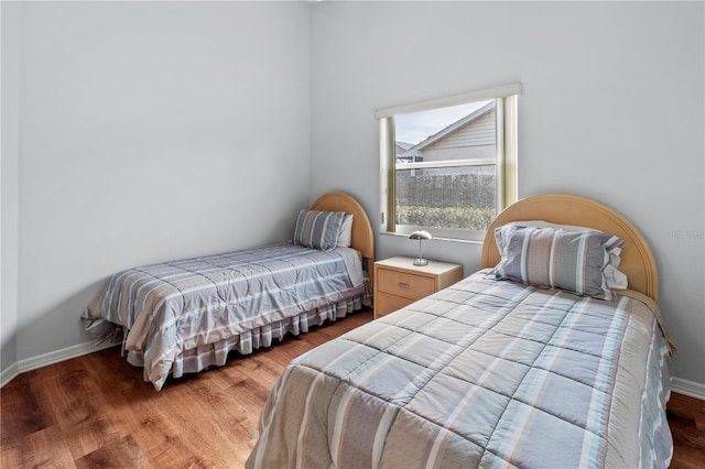 bedroom with hardwood / wood-style floors