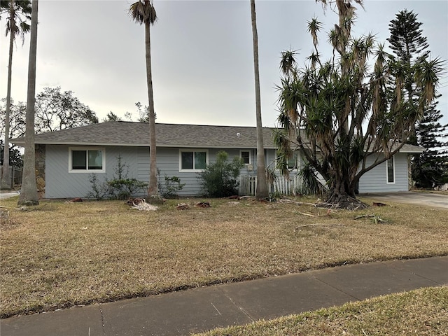 ranch-style house with a front lawn