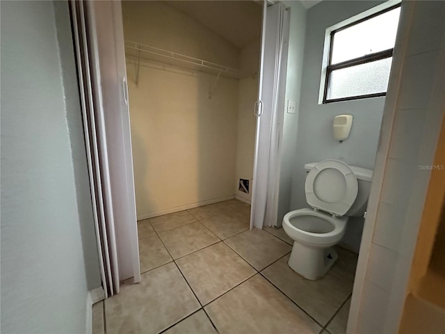 bathroom with tile patterned floors and toilet