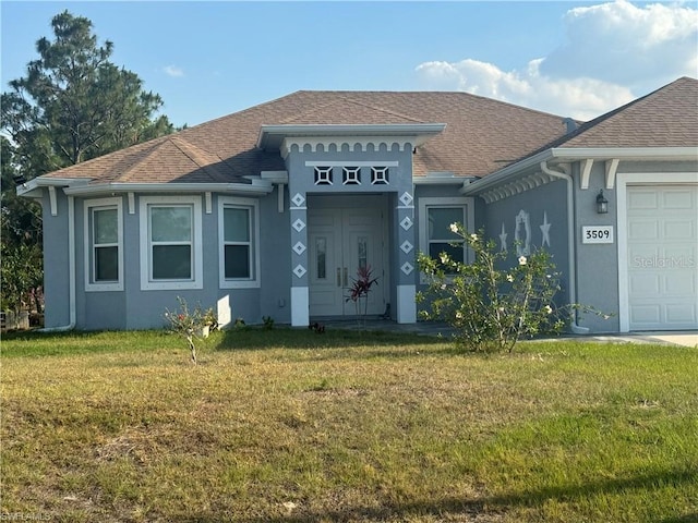 view of front facade featuring a garage and a front lawn