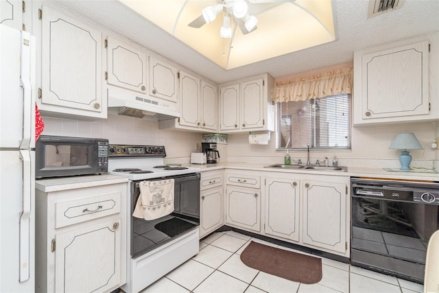 kitchen featuring black appliances, light tile patterned flooring, white cabinetry, and sink