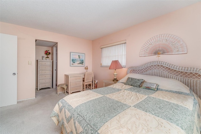 carpeted bedroom featuring a textured ceiling