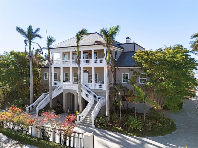 view of front of home with a balcony and a porch